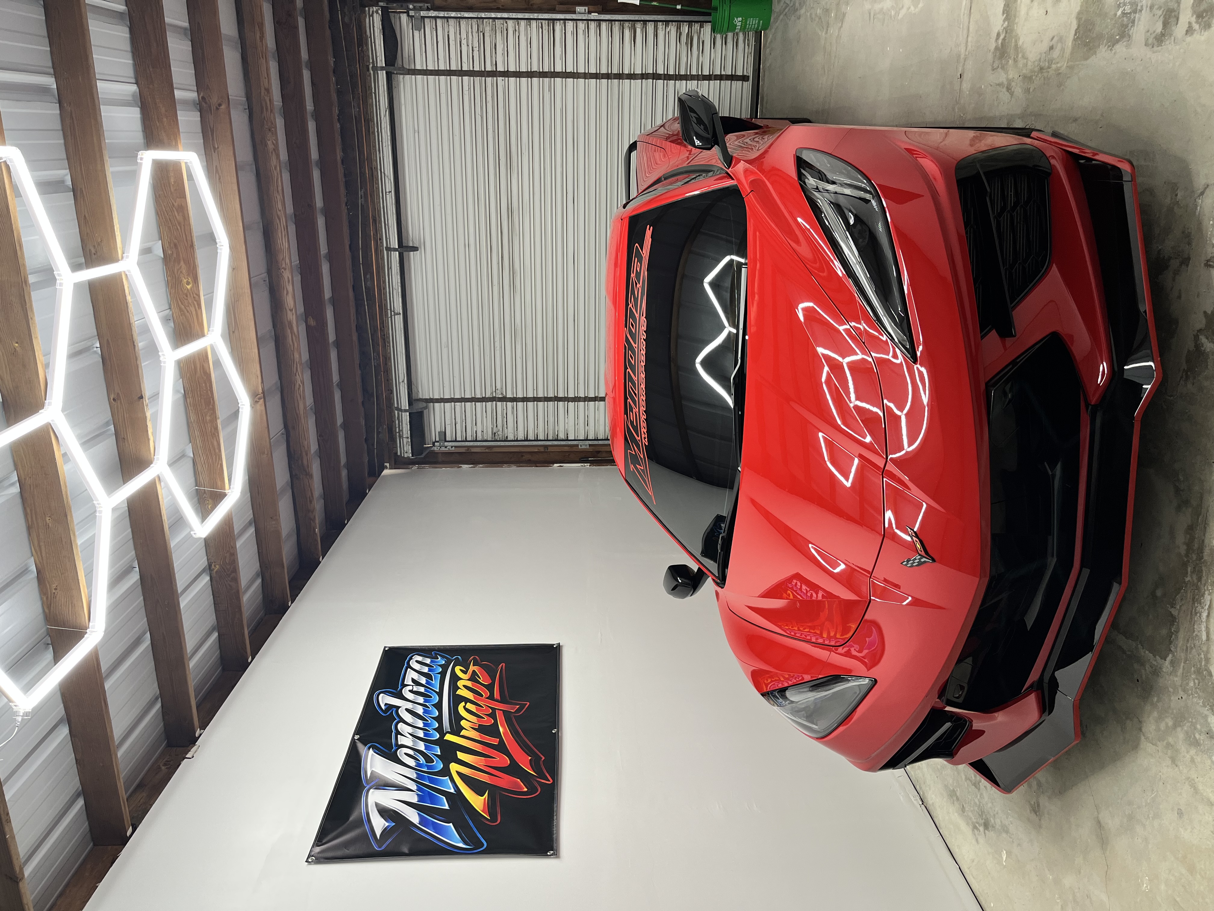 Red Corvette project inside the Mendoza Wraps shop