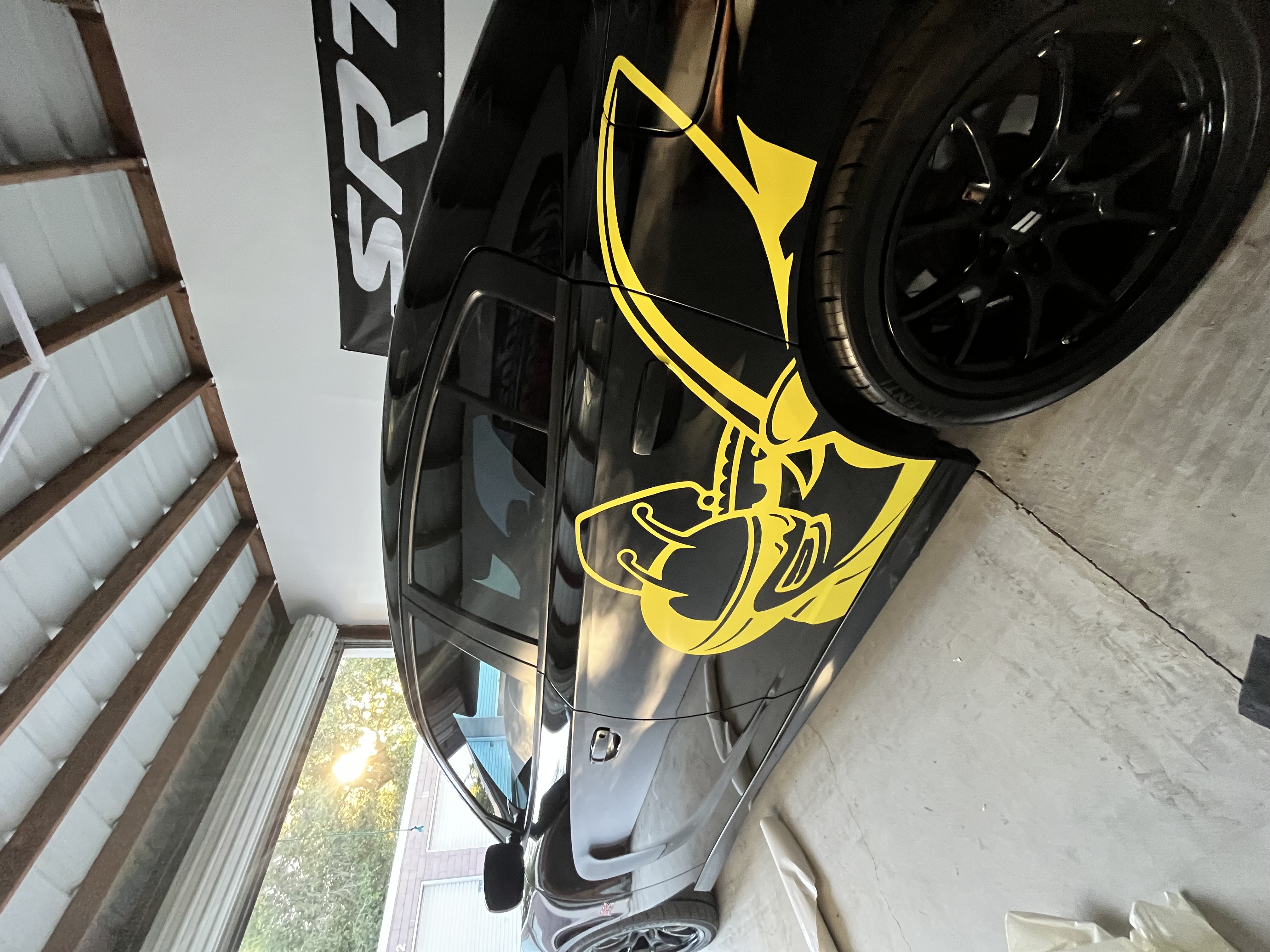 Custom yellow bee decal on a vehicle