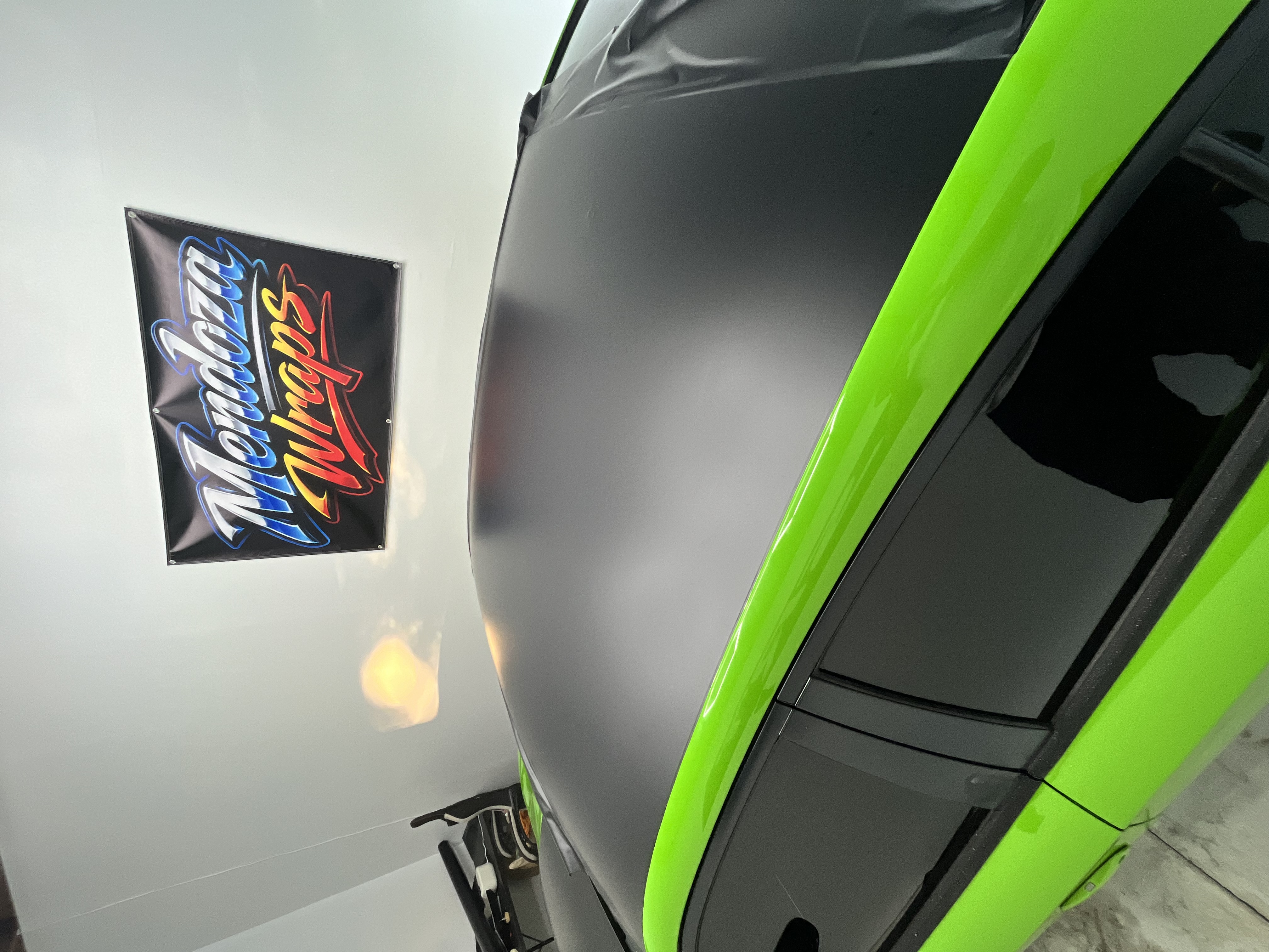 Gray and green partial vehicle wrap project